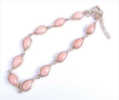Lot 1218 - A 9ct yellow gold coral bracelet, comprising...
