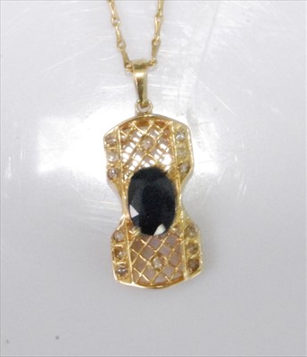 Lot 1230 - A yellow metal, sapphire and diamond filigree...
