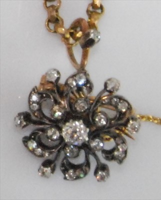 Lot 1234 - A late Victorian circular flower brooch...