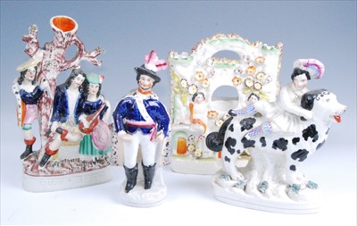 Lot 1125 - A Victorian Staffordshire flatback spill vase '...