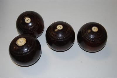 Lot 46 - Four lignam vitae lawn bowls