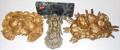 Lot 83 - A carved softwood and gilt painted lions head...