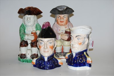 Lot 102 - A 19th century Staffordshire Toby jug, in...