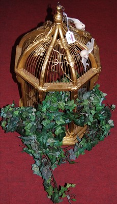 Lot 130 - A gilt painted and hanging wirework bird cage...
