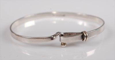 Lot 341 - A Tiffany & Co silver bangle, in original card...