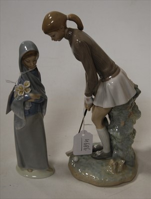 Lot 143 - A Lladro porcelain figure of a female golfer,...