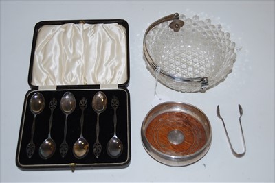 Lot 203 - A modern silver bottle coaster of squat...