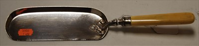 Lot 244 - An Edwardian silver crumb scoop having a faux...