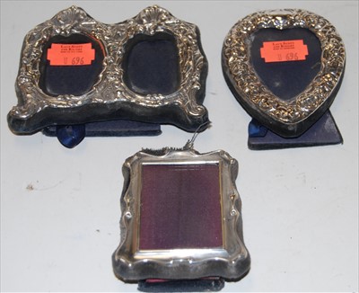 Lot 253 - Circa 1900 silver and embossed heart shaped...