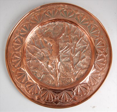 Lot 179 - An Arts & Crafts circular embossed and chased...