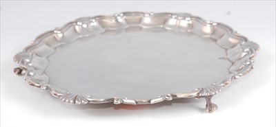 Lot 1155 - An Edwardian silver salver, having a piecrust...