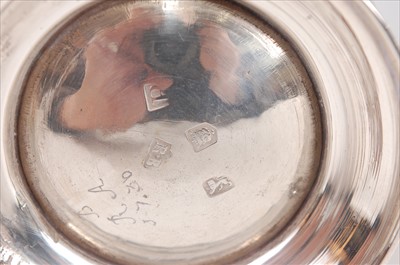 Lot 1157 - A George II silver bell shaped tankard, having...