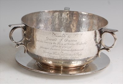 Lot 142 - An Arts & Crafts silver circular three handled...