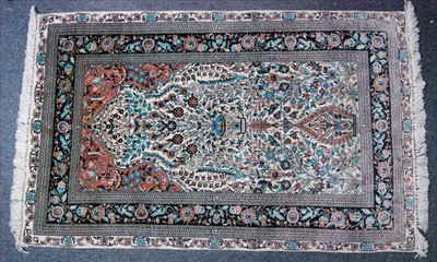 Lot 1502 - A Persian silk fine weave Hereke rug, the...
