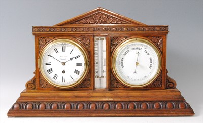 Lot 21 - A Victorian carved oak desk weather station,...