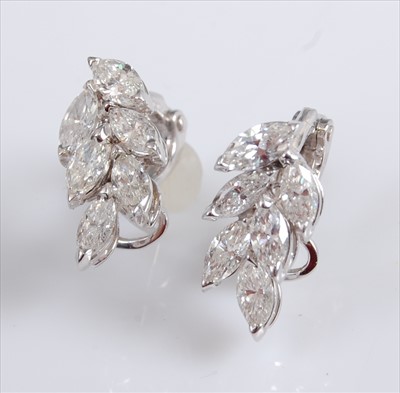 Lot 2236 - A pair of 18ct white gold diamond cluster...