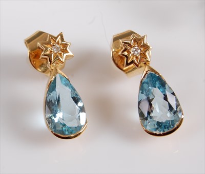 Lot 1237 - A pair of yellow metal pear shaped aquamarine...