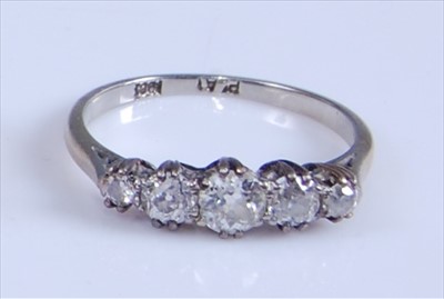 Lot 1212 - A yellow and white metal diamond five-stone...
