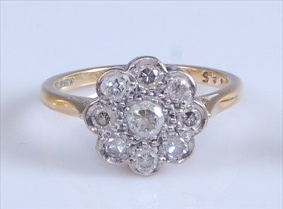 Lot 1210 - An 18ct yellow and white gold diamond circular...