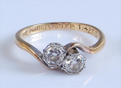 Lot 1241 - A yellow and white metal two-stone diamond...