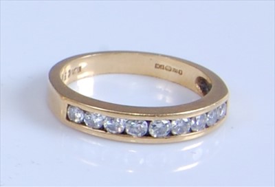Lot 1248 - An 18ct yellow gold diamond nine-stone half...