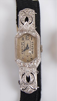 Lot 1261 - A white metal diamond set manual wind cocktail...