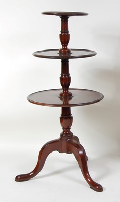 Lot 1119 - A George III mahogany three-tier dumb waiter,...