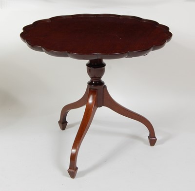 Lot 1267 - A mahogany pedestal wine table, having a...