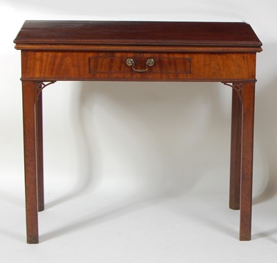 Lot 1236 - A George III mahogany tea table, the fold-over...