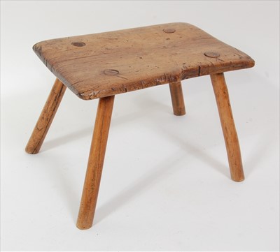 Lot 1524 - An 18th century fruitwood milking stool,...