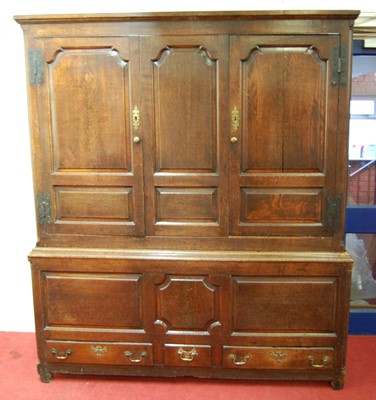 Lot 1169 - A George III joined oak housekeepers cupboard,...