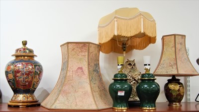 Lot 15 - A modern table lamp surmounted by a resin...