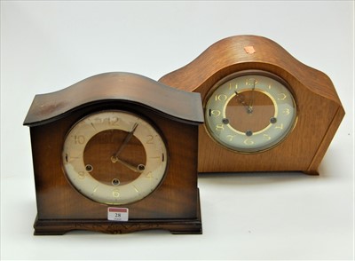 Lot 28 - A 1950s oak cased mantel clock having a...