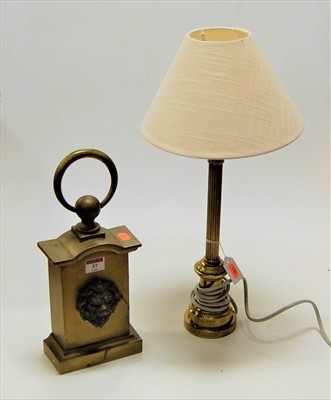 Lot 37 - A large brass and iron doorstop having lion...
