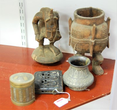 Lot 49 - A 20th century tribal carved softwood cup and...