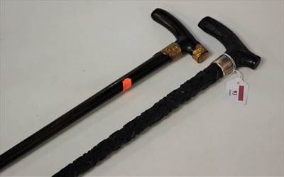 Lot 93 - A late Victorian bog oak walking cane, the...