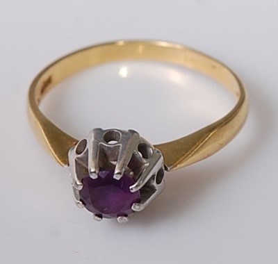 Lot 409 - A modern 18ct gold and claw set amethyst dress...