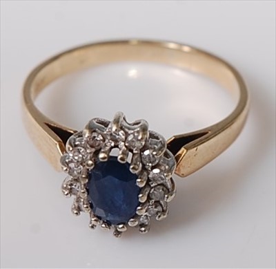 Lot 411 - A modern 9ct gold, blue and white sapphire...
