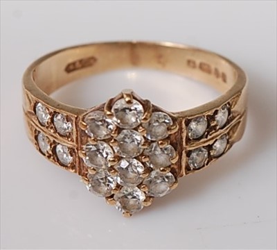 Lot 412 - A modern 9ct yellow gold and white sapphire...
