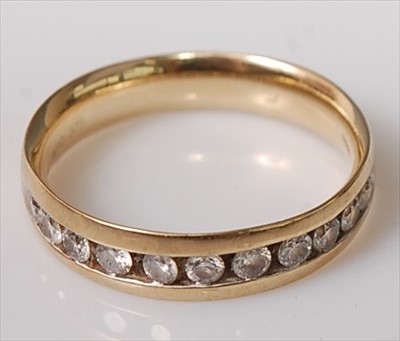 Lot 414 - A 9ct gold diamond half eternity ring,...