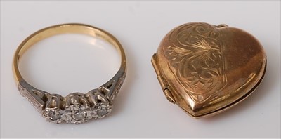 Lot 416 - An 18ct gold diamond three stone ring, the...