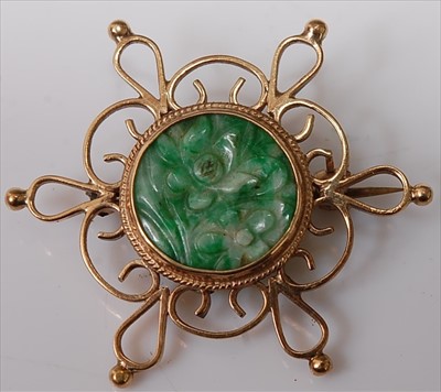 Lot 430 - A carved green and celadon jade flower head...