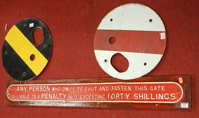 Lot 557 - A cast iron railway sign 'Any person who omits...