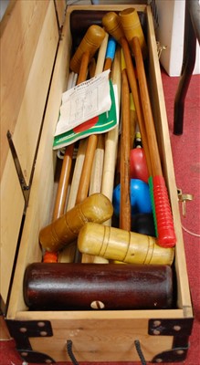 Lot 576 - A Jarrolds croquet set, housed in a pine case