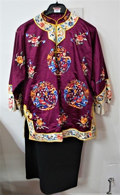 Lot 580 - A 20th century Chinese purple silk childs robe,...