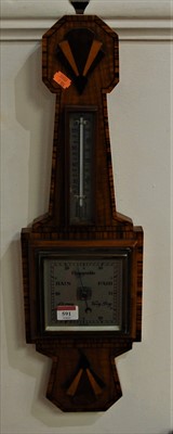 Lot 591 - A 1930s Art Deco walnut wall barometer, having...