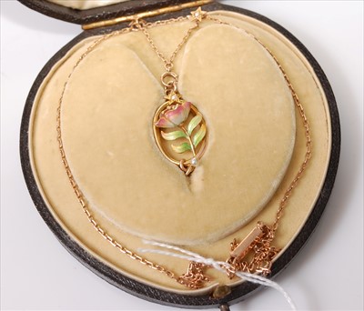 Lot 2209 - A rose and yellow metal oval pendant,...