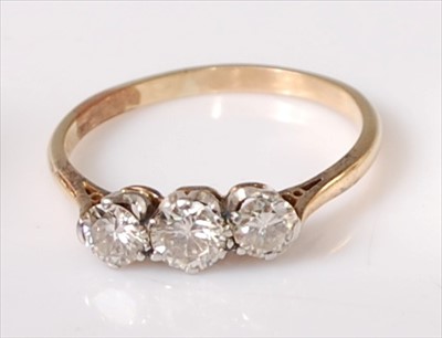 Lot 2204 - A yellow and white metal diamond three stone...