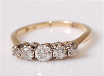 Lot 2196 - A yellow and white metal diamond five stone...