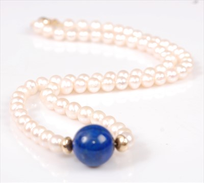 Lot 2211 - A single row necklet, comprising seventy-two 5....